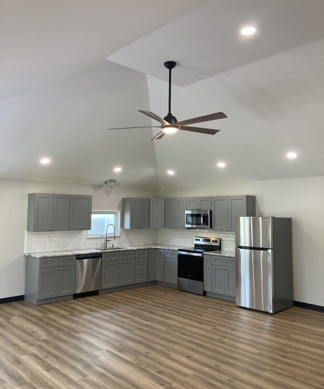 kitchen and living area with high ceilings